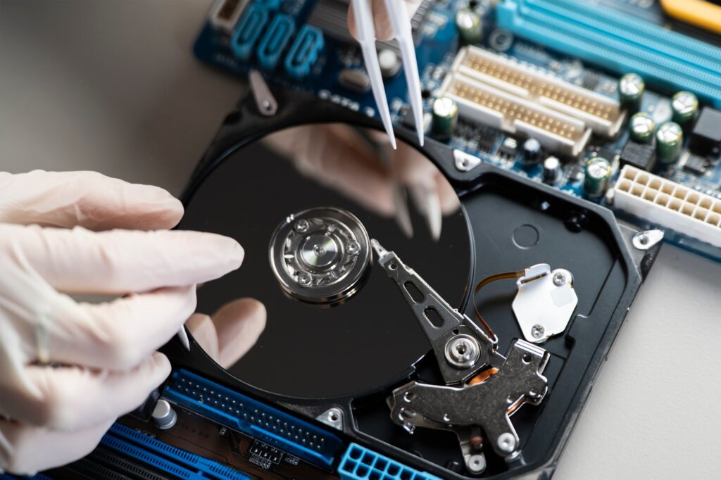 A Disassembled Hard Drive In The Service Center, Fixing The Problem With Storage