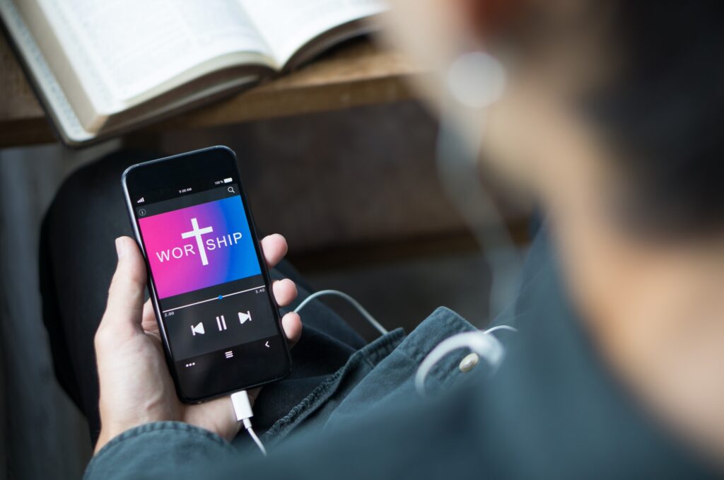 Christian Holding Mobile Phone Praying Worship To God With Church Online Sunday Live Church.