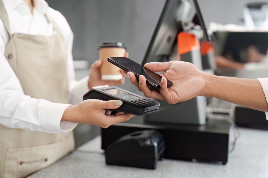 Retail It Services | Pos Support, Network Security &Amp; Compliance 1 Retail It Services | Contactless Payment Transaction At Coffee Shop With Smartphone And Pos Terminal
