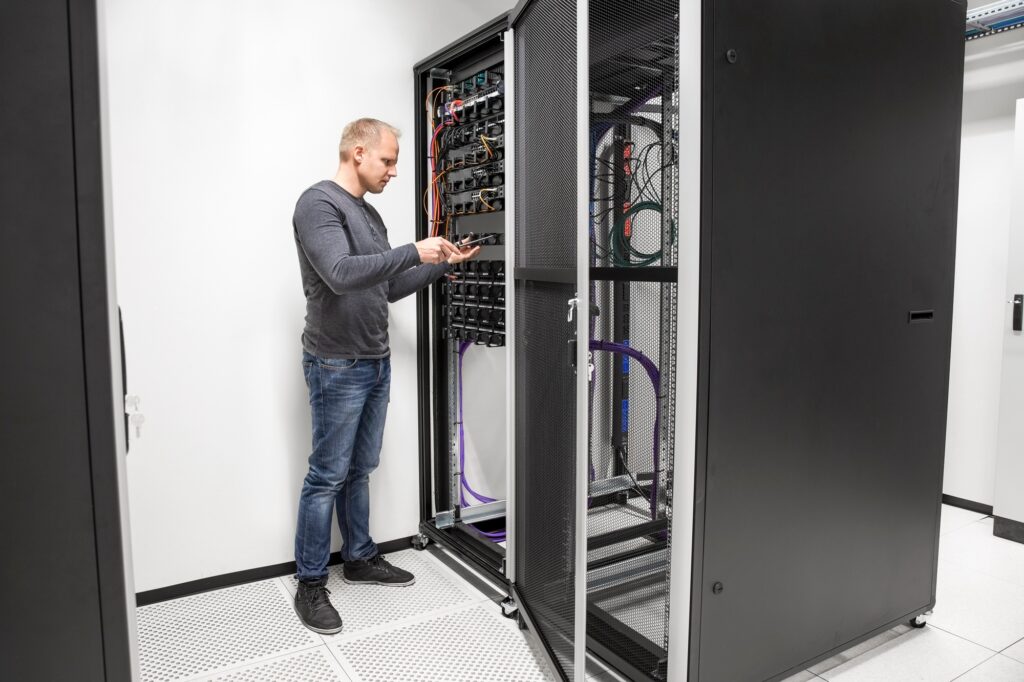 It Consultant Building Network Rack In Datacenter